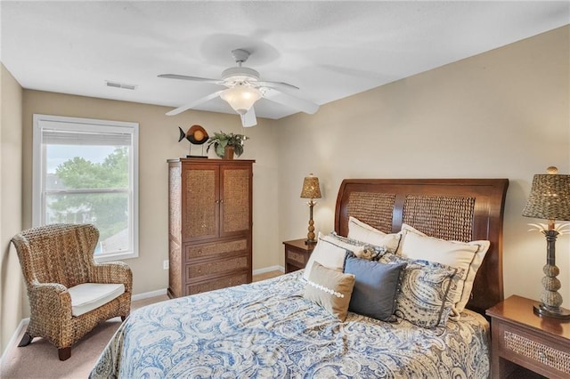 bedroom featuring ceiling fan, visible vents, and baseboards