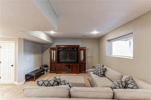 living room featuring light carpet and baseboards