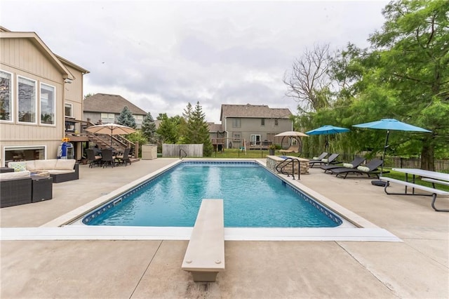 view of pool featuring a patio area, fence, an outdoor hangout area, and a fenced in pool