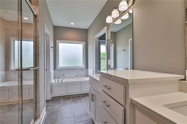 full bathroom with a garden tub, recessed lighting, two vanities, a shower stall, and tile patterned flooring