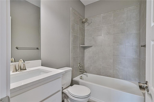 bathroom featuring bathtub / shower combination, vanity, and toilet