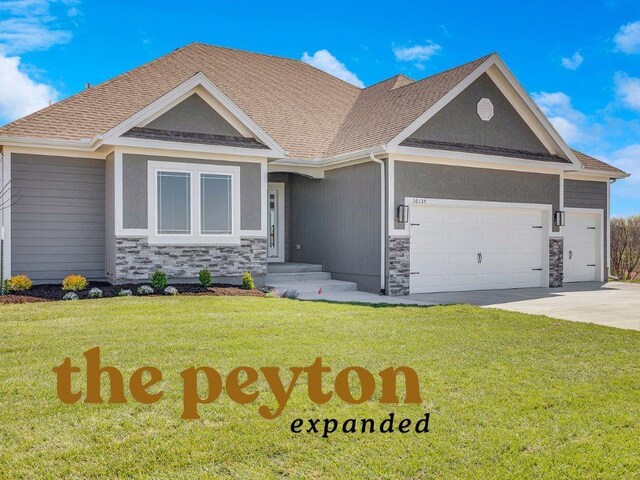 view of front of house featuring stone siding, a garage, a front yard, and driveway