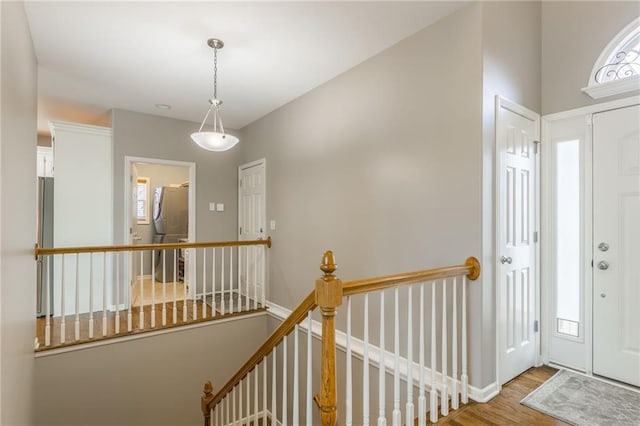 entryway with wood finished floors