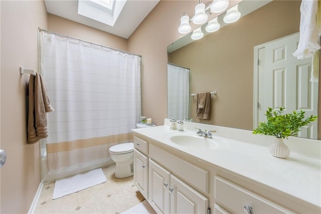 full bath featuring toilet, curtained shower, a skylight, tile patterned flooring, and vanity