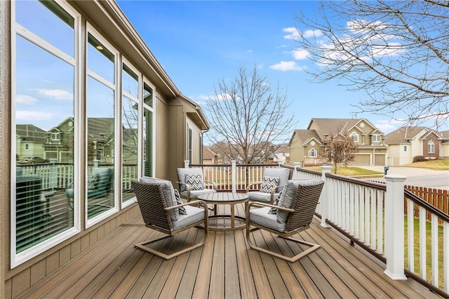 wooden terrace featuring a residential view