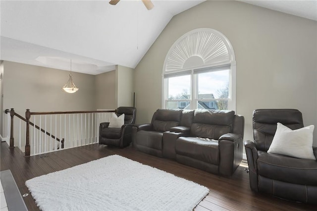 living area featuring ceiling fan, high vaulted ceiling, and dark wood-style flooring