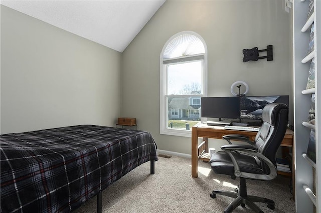 carpeted bedroom with vaulted ceiling and baseboards