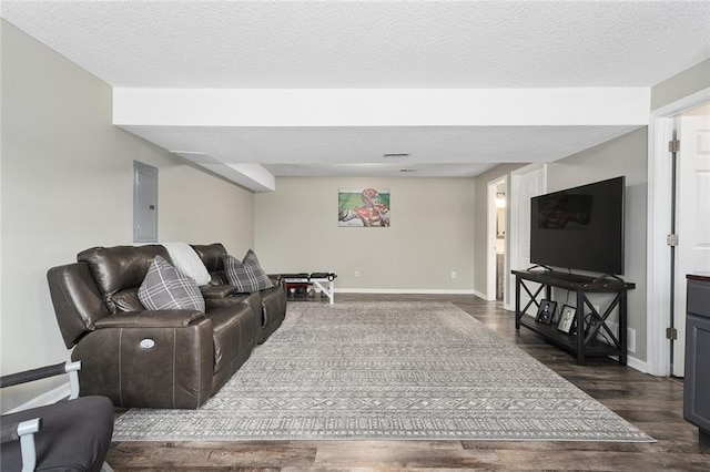 living area featuring electric panel, a textured ceiling, baseboards, and dark wood-style flooring