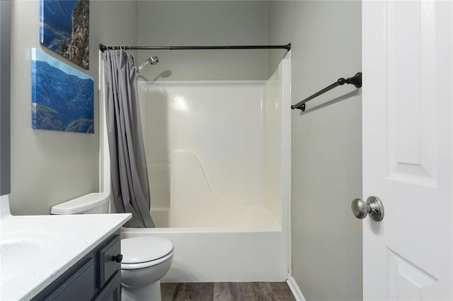 bathroom with shower / tub combo, vanity, toilet, and wood finished floors