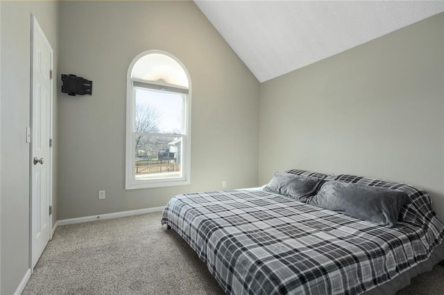 bedroom featuring lofted ceiling, carpet, and baseboards