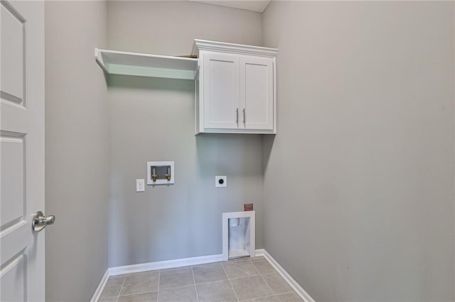 washroom with light tile patterned floors, hookup for a washing machine, cabinet space, electric dryer hookup, and baseboards