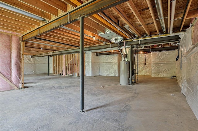 unfinished basement featuring gas water heater