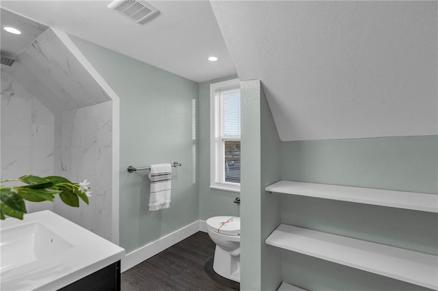 full bathroom featuring lofted ceiling, toilet, wood finished floors, vanity, and visible vents