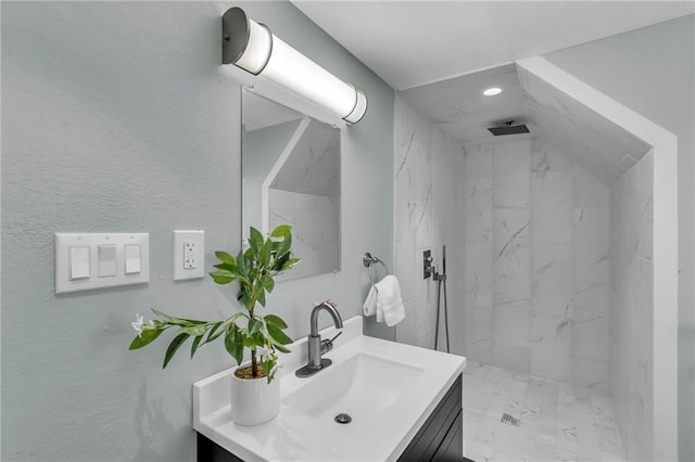 full bath with visible vents, marble finish floor, a marble finish shower, and vanity