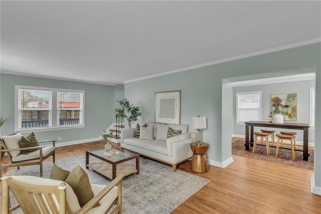 936 E Gregory Blvd, Kansas City, MO 64131 - living room with ornamental molding, healthy amount of natural light, and light wood-style floors