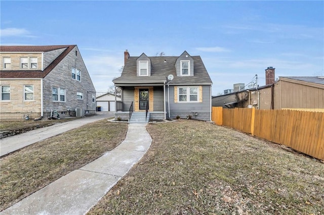 936 E Gregory Blvd, Kansas City, MO 64131 - view of front of property with an outdoor structure, a chimney, and a porch
