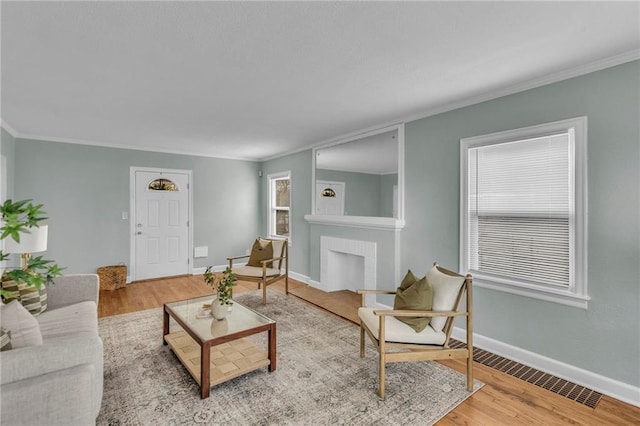 936 E Gregory Blvd, Kansas City, MO 64131 - living room featuring crown molding and wood finished floors