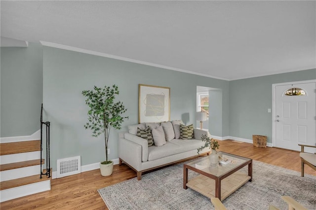 936 E Gregory Blvd, Kansas City, MO 64131 - living area featuring wood finished floors, crown molding, and stairway