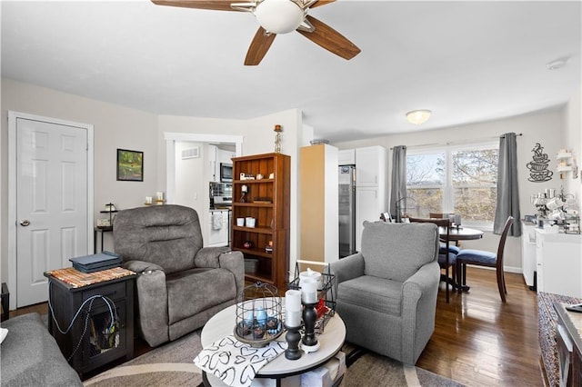 living room with ceiling fan and wood finished floors