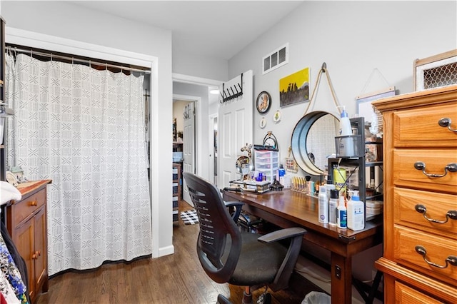 office space featuring visible vents and dark wood finished floors