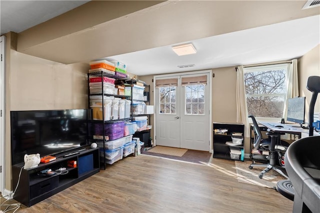 office with visible vents and wood finished floors