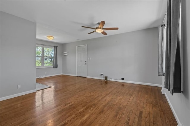 904 E Golf Hill Dr, Excelsior Springs, MO 64024 - spare room with ceiling fan, hardwood / wood-style flooring, and baseboards