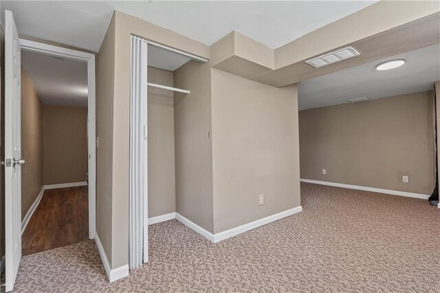 904 E Golf Hill Dr, Excelsior Springs, MO 64024 - unfurnished bedroom featuring carpet floors, baseboards, and a closet