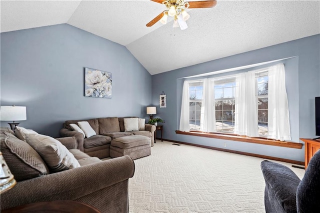 living area featuring baseboards, a ceiling fan, carpet, vaulted ceiling, and a textured ceiling