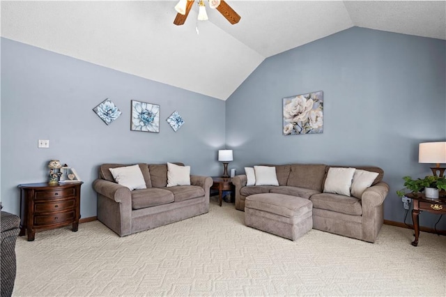 living area featuring lofted ceiling, baseboards, a ceiling fan, and light colored carpet