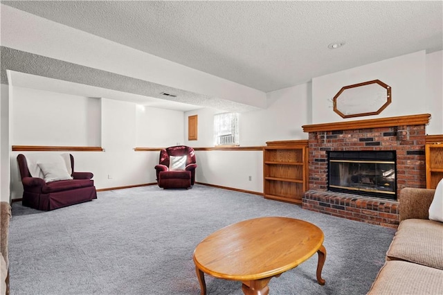 living room with carpet floors, visible vents, a fireplace, and a textured ceiling