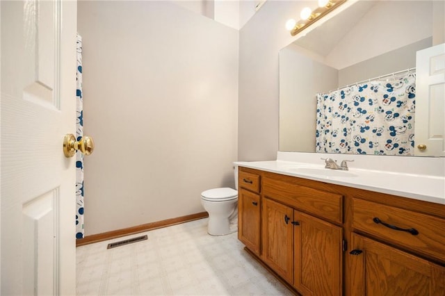 full bathroom with visible vents, toilet, vanity, baseboards, and tile patterned floors