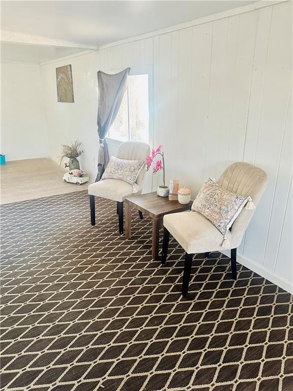 sitting room featuring ornamental molding