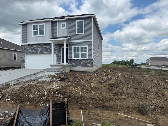 21800 Lucca Ln, Peculiar, MO 64078 - view of front of home with stone siding, driveway, and a garage