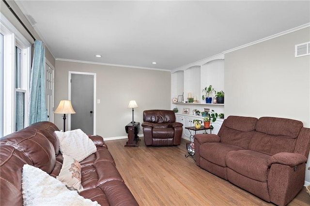 living room with crown molding, recessed lighting, visible vents, light wood-type flooring, and baseboards