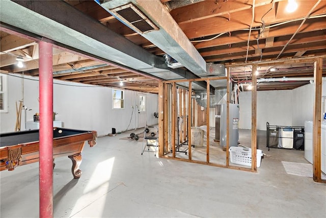 basement featuring pool table and electric water heater