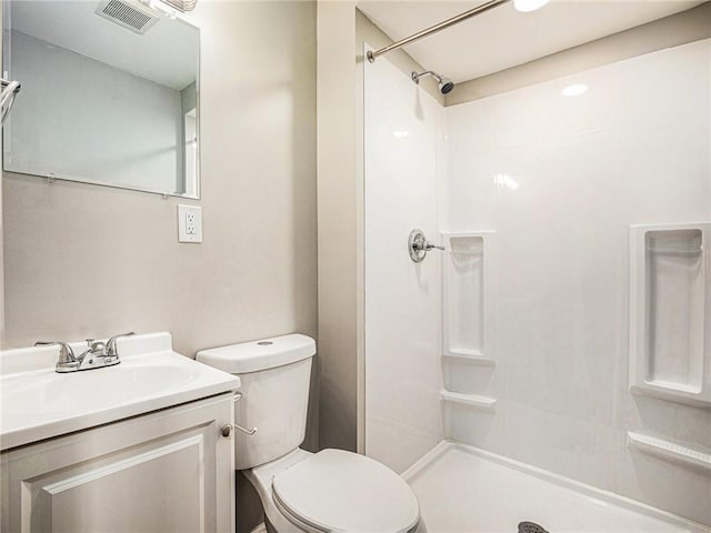 full bath featuring visible vents, vanity, toilet, and a shower