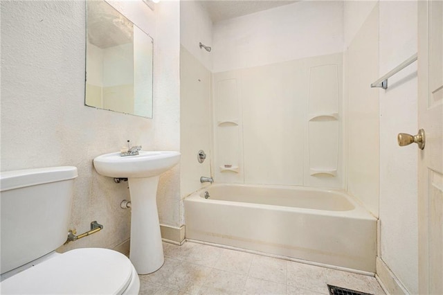 bathroom with  shower combination, toilet, and baseboards