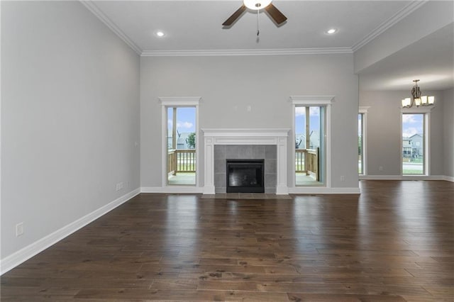 unfurnished living room featuring a fireplace, dark wood finished floors, and baseboards