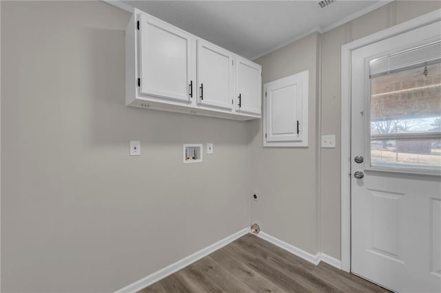 clothes washing area featuring washer hookup, baseboards, cabinet space, dark wood-style floors, and electric dryer hookup