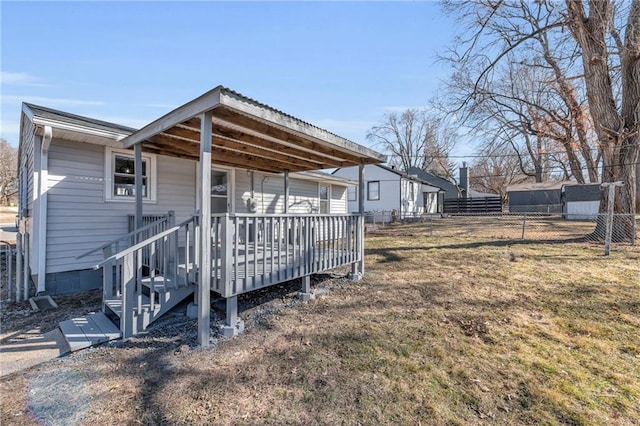 view of home's exterior featuring fence