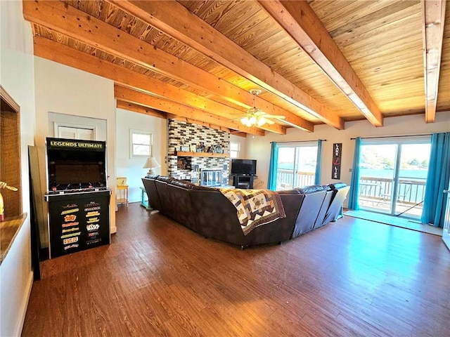 living room featuring wood ceiling, a fireplace, beam ceiling, and wood finished floors