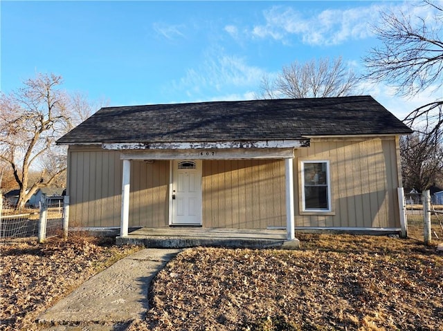 view of outbuilding with fence