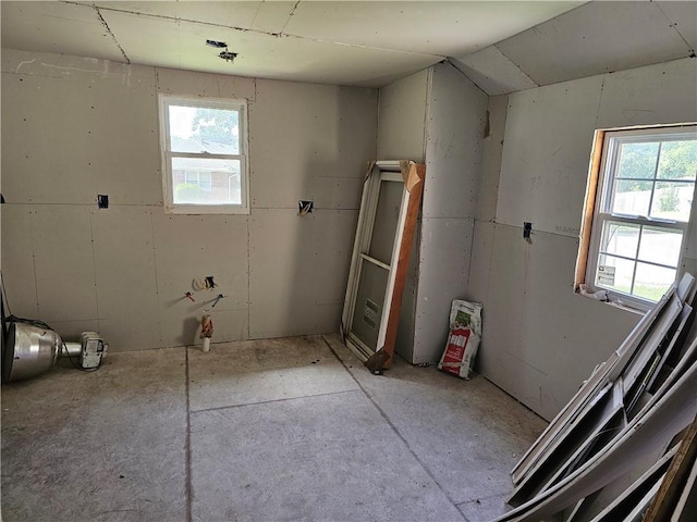 bathroom with lofted ceiling and a healthy amount of sunlight