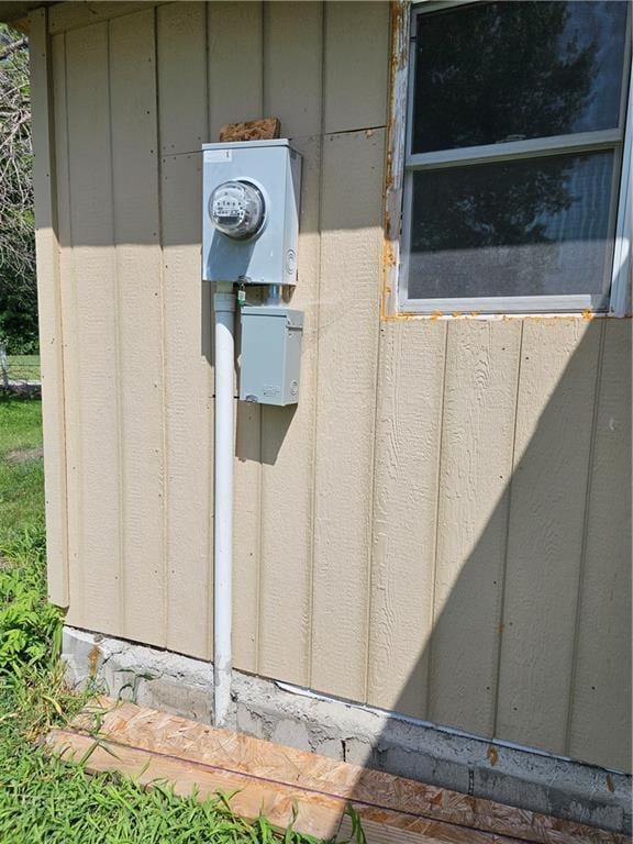 details with electric meter and board and batten siding