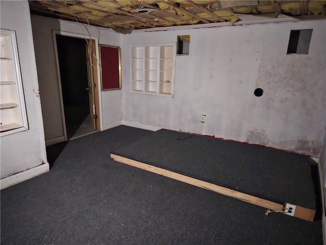 empty room with dark carpet