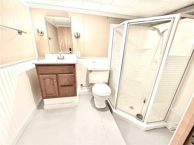 full bath featuring toilet, ornamental molding, a stall shower, and vanity