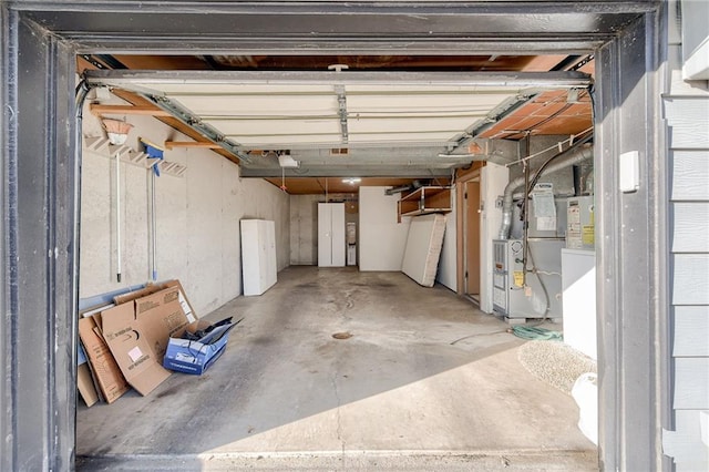 garage with a garage door opener and heating unit