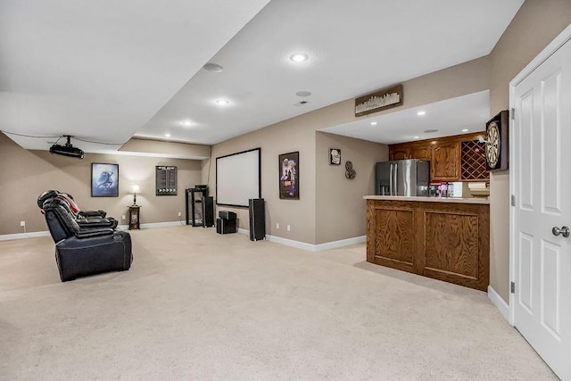 living area with baseboards, recessed lighting, and light colored carpet