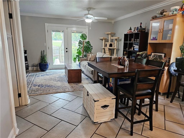 dining area with ornamental molding, a ceiling fan, and french doors