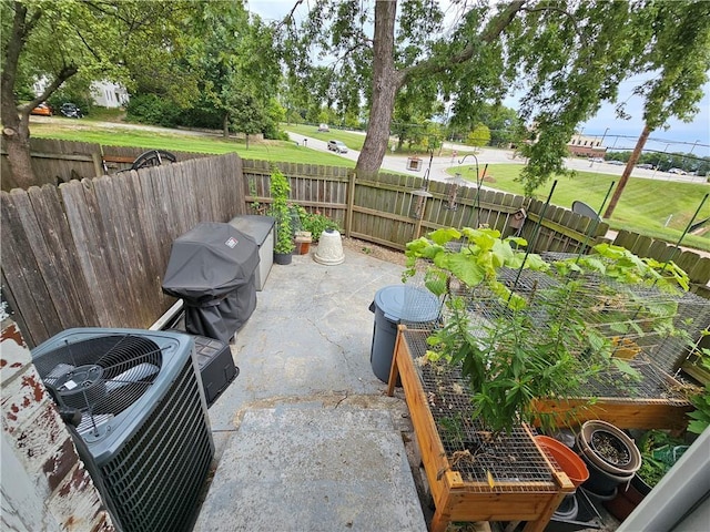 view of patio / terrace with a fenced backyard and central AC